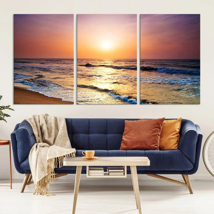 A cozy living room features the breathtaking California Coastline Sunset Canvas Art, capturing ocean waves crashing on cliffs to create the perfect coastal ambiance.