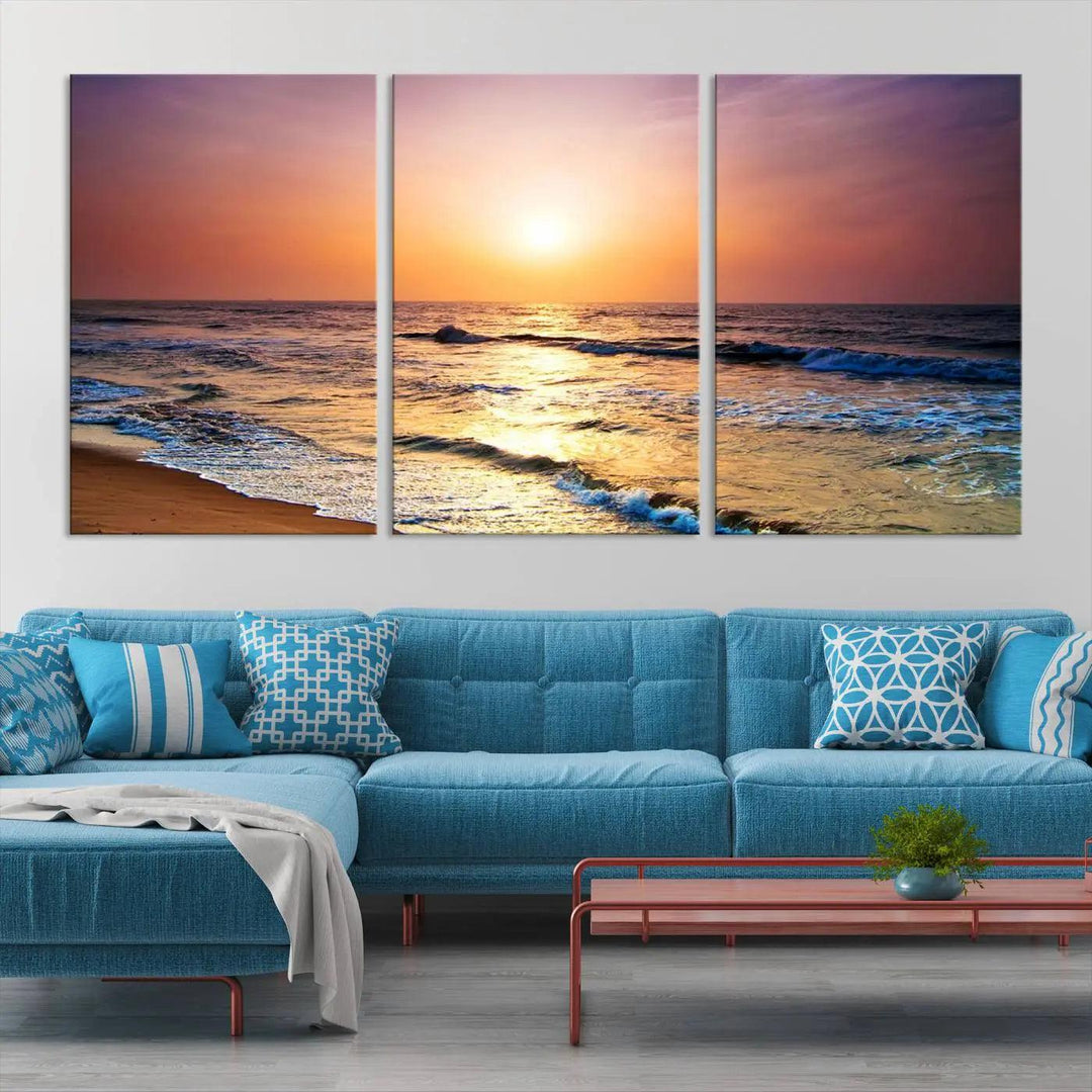 A cozy living room features the breathtaking California Coastline Sunset Canvas Art, capturing ocean waves crashing on cliffs to create the perfect coastal ambiance.