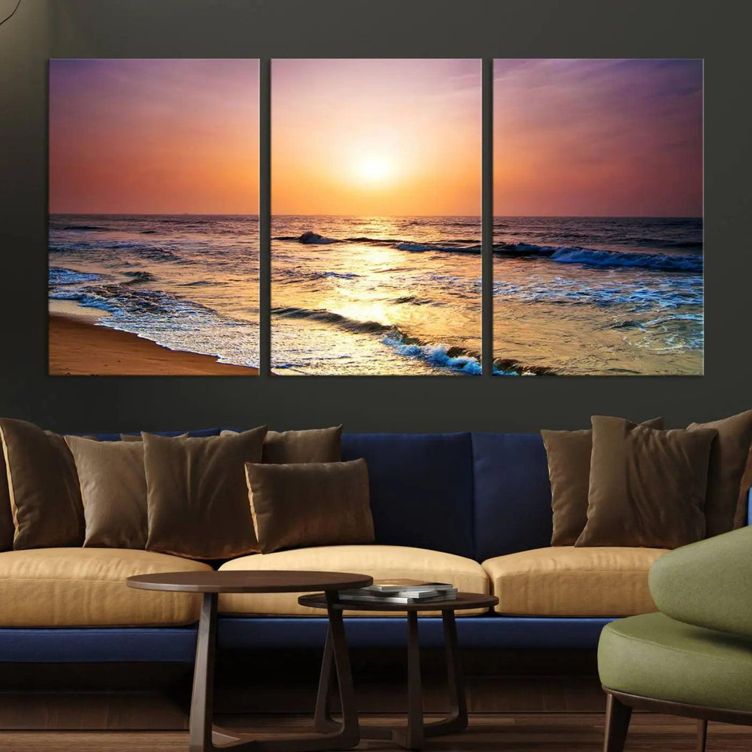 A cozy living room features the breathtaking California Coastline Sunset Canvas Art, capturing ocean waves crashing on cliffs to create the perfect coastal ambiance.