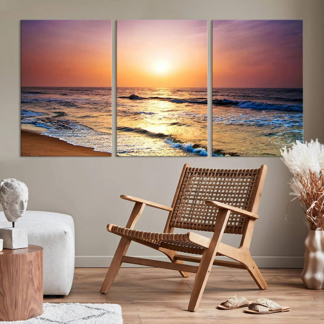 A cozy living room features the breathtaking California Coastline Sunset Canvas Art, capturing ocean waves crashing on cliffs to create the perfect coastal ambiance.