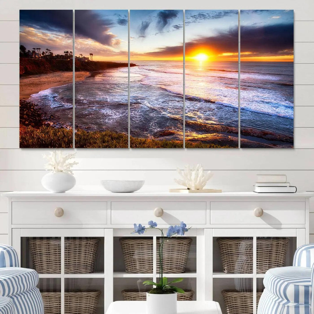 The California Coastline Sunset Canvas Art, featuring ocean waves crashing on cliffs, is presented as a large, framed giclee canvas print. This stunning piece is the perfect complement to any coastal interior.