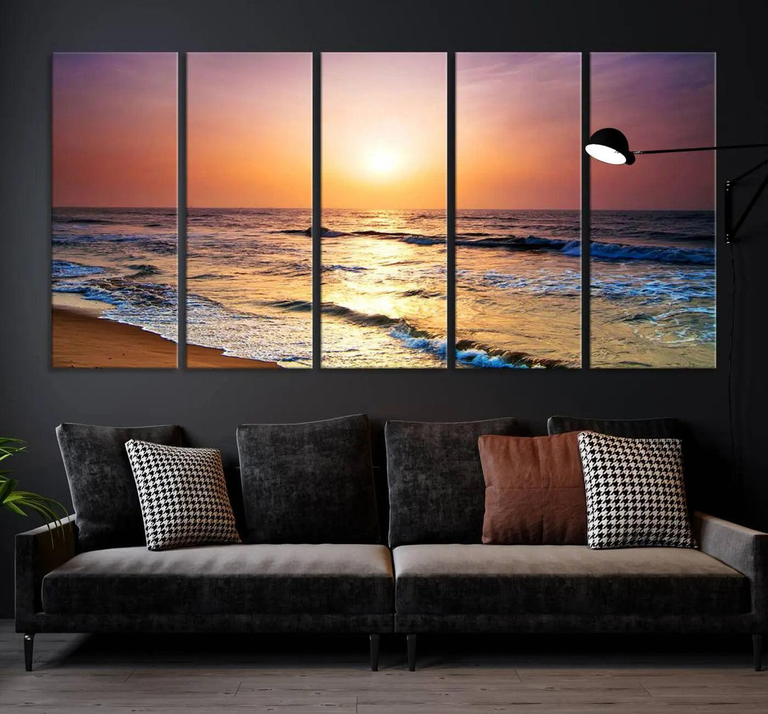 A cozy living room features the breathtaking California Coastline Sunset Canvas Art, capturing ocean waves crashing on cliffs to create the perfect coastal ambiance.