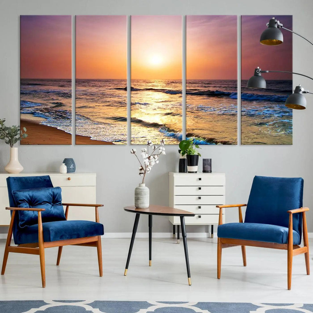 A cozy living room features the breathtaking California Coastline Sunset Canvas Art, capturing ocean waves crashing on cliffs to create the perfect coastal ambiance.