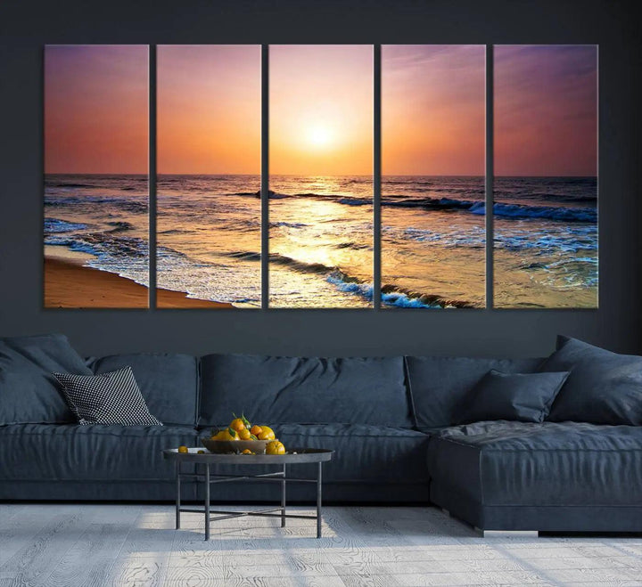 A cozy living room features the breathtaking California Coastline Sunset Canvas Art, capturing ocean waves crashing on cliffs to create the perfect coastal ambiance.