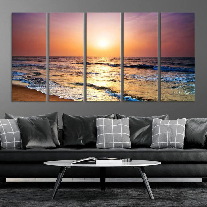 A cozy living room features the breathtaking California Coastline Sunset Canvas Art, capturing ocean waves crashing on cliffs to create the perfect coastal ambiance.