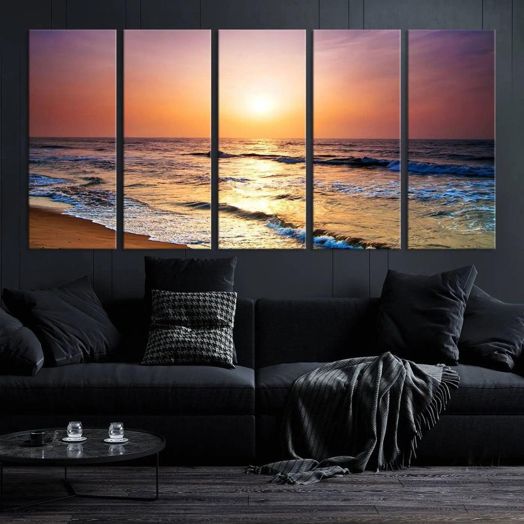 A cozy living room features the breathtaking California Coastline Sunset Canvas Art, capturing ocean waves crashing on cliffs to create the perfect coastal ambiance.