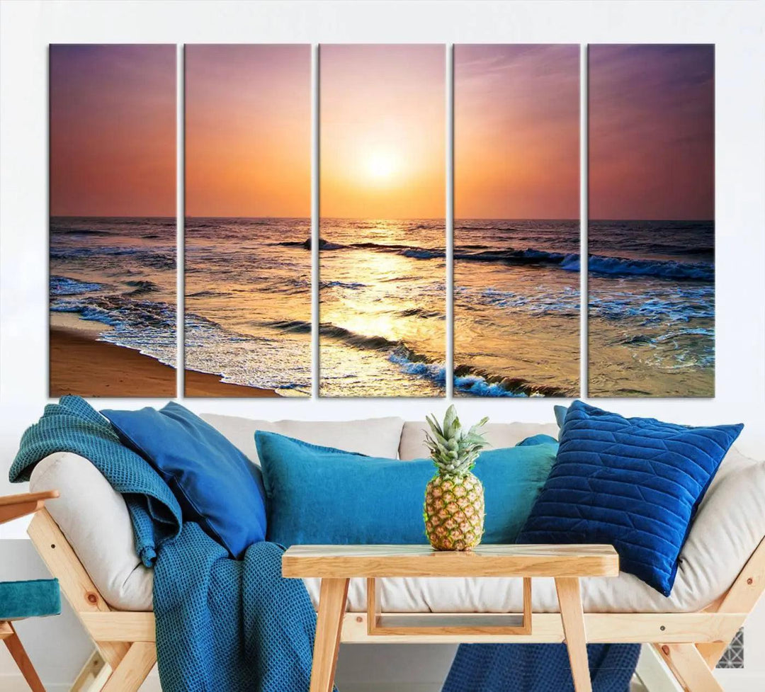 A cozy living room features the breathtaking California Coastline Sunset Canvas Art, capturing ocean waves crashing on cliffs to create the perfect coastal ambiance.