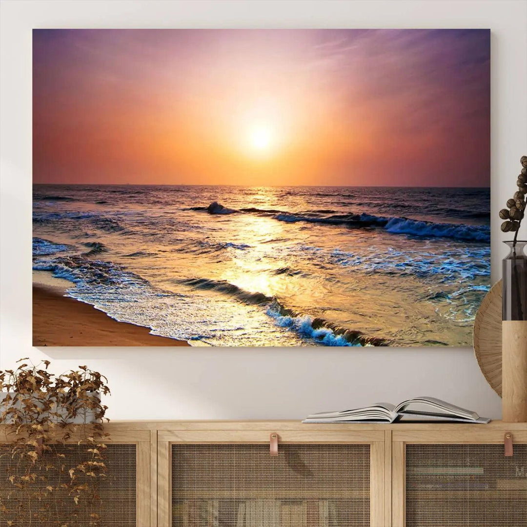 A cozy living room features the breathtaking California Coastline Sunset Canvas Art, capturing ocean waves crashing on cliffs to create the perfect coastal ambiance.