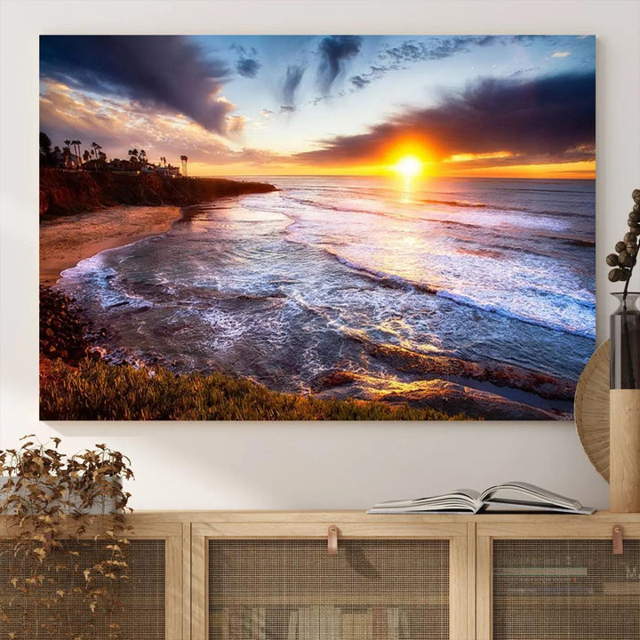 The California Coastline Sunset Canvas Art, featuring ocean waves crashing on cliffs, is presented as a large, framed giclee canvas print. This stunning piece is the perfect complement to any coastal interior.