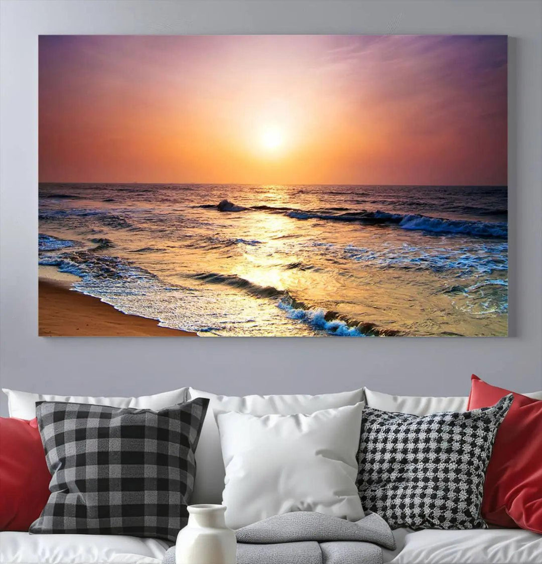 A cozy living room features the breathtaking California Coastline Sunset Canvas Art, capturing ocean waves crashing on cliffs to create the perfect coastal ambiance.