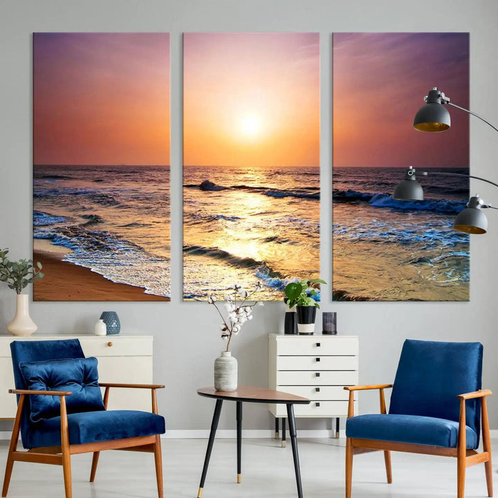 A cozy living room features the breathtaking California Coastline Sunset Canvas Art, capturing ocean waves crashing on cliffs to create the perfect coastal ambiance.