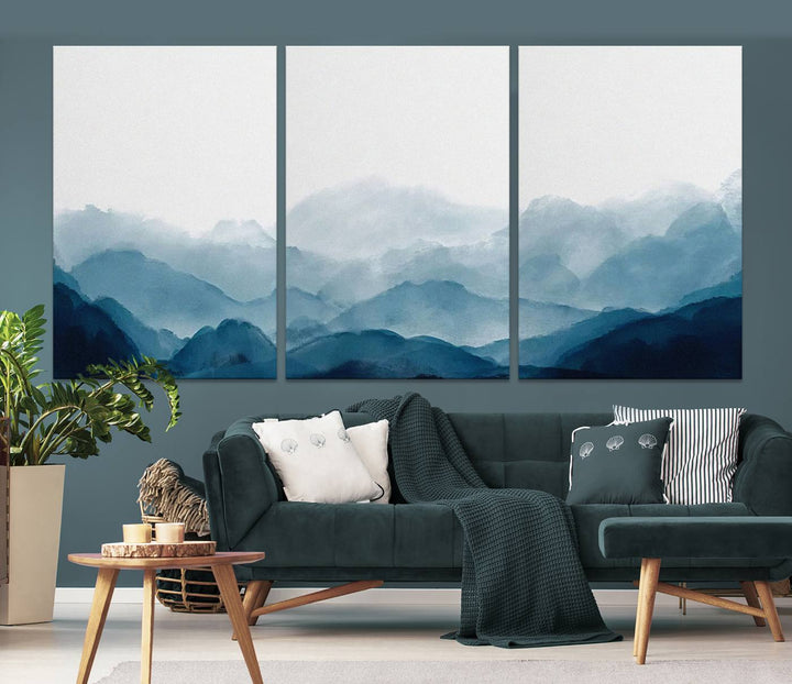 A modern living room features a three-panel canvas of green forest nature scenery photography on the wall. The artwork is gallery wrapped in museum-quality canvases, ensuring both durability and an exquisite display.