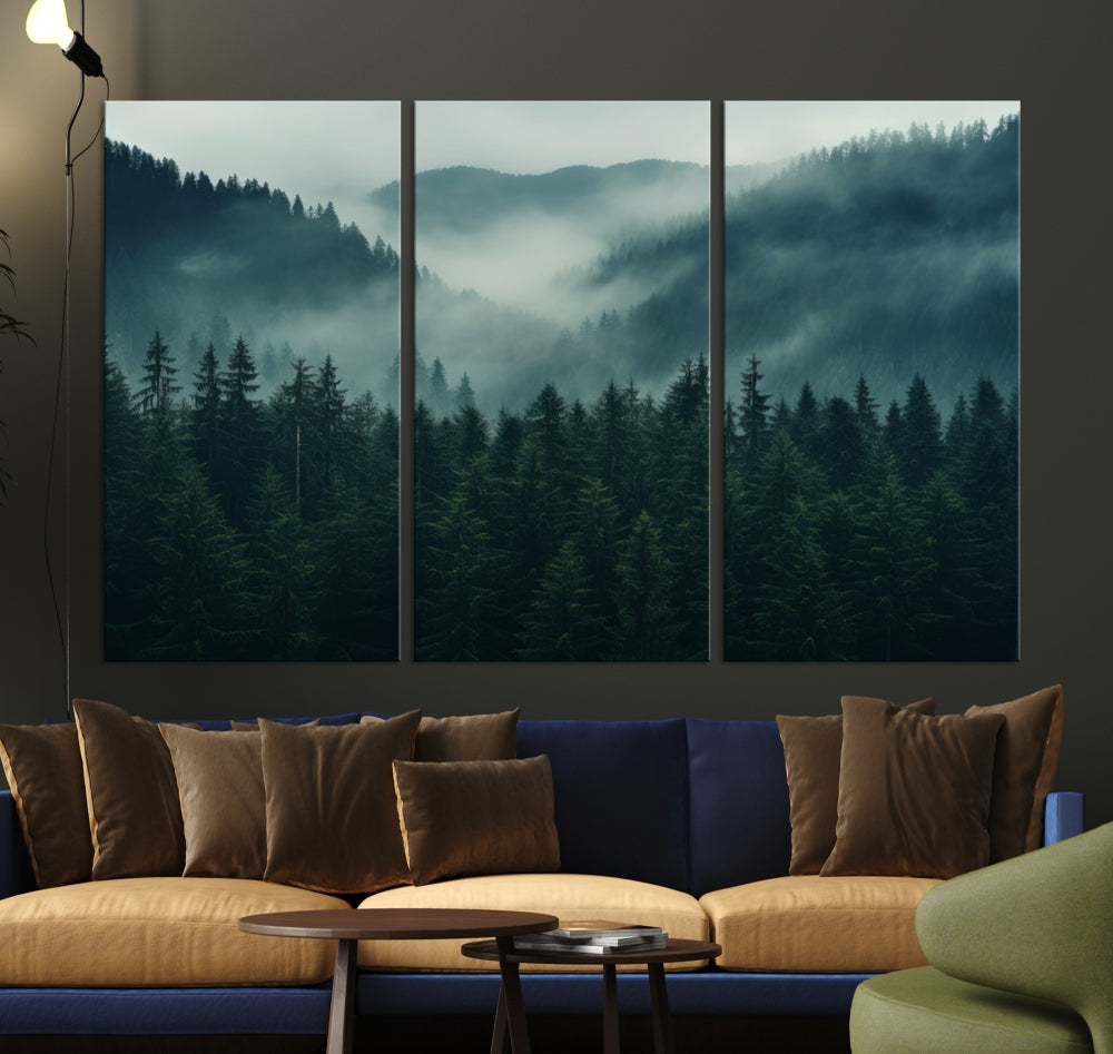 The Captivating Misty Forest Wall Art Premium Canvas Print adds a foggy and serene atmosphere to the living room with its large triptych on gallery-wrapped museum-quality canvas.