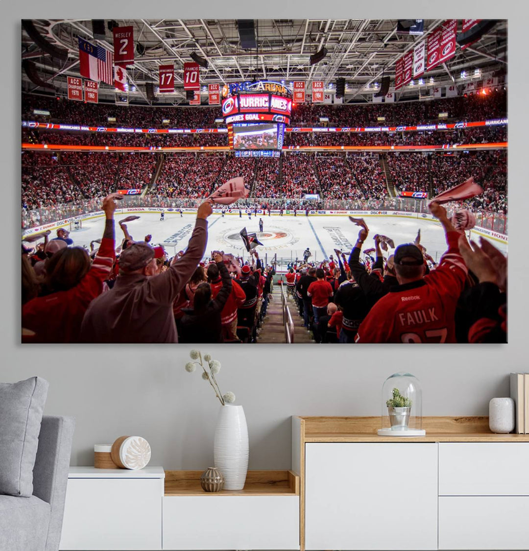 A museum-quality canvas print captures the excitement of hockey enthusiasts cheering in a bustling arena. This artwork provides a vibrant depiction of the Carolina Hurricanes Ice Hockey Stadium.