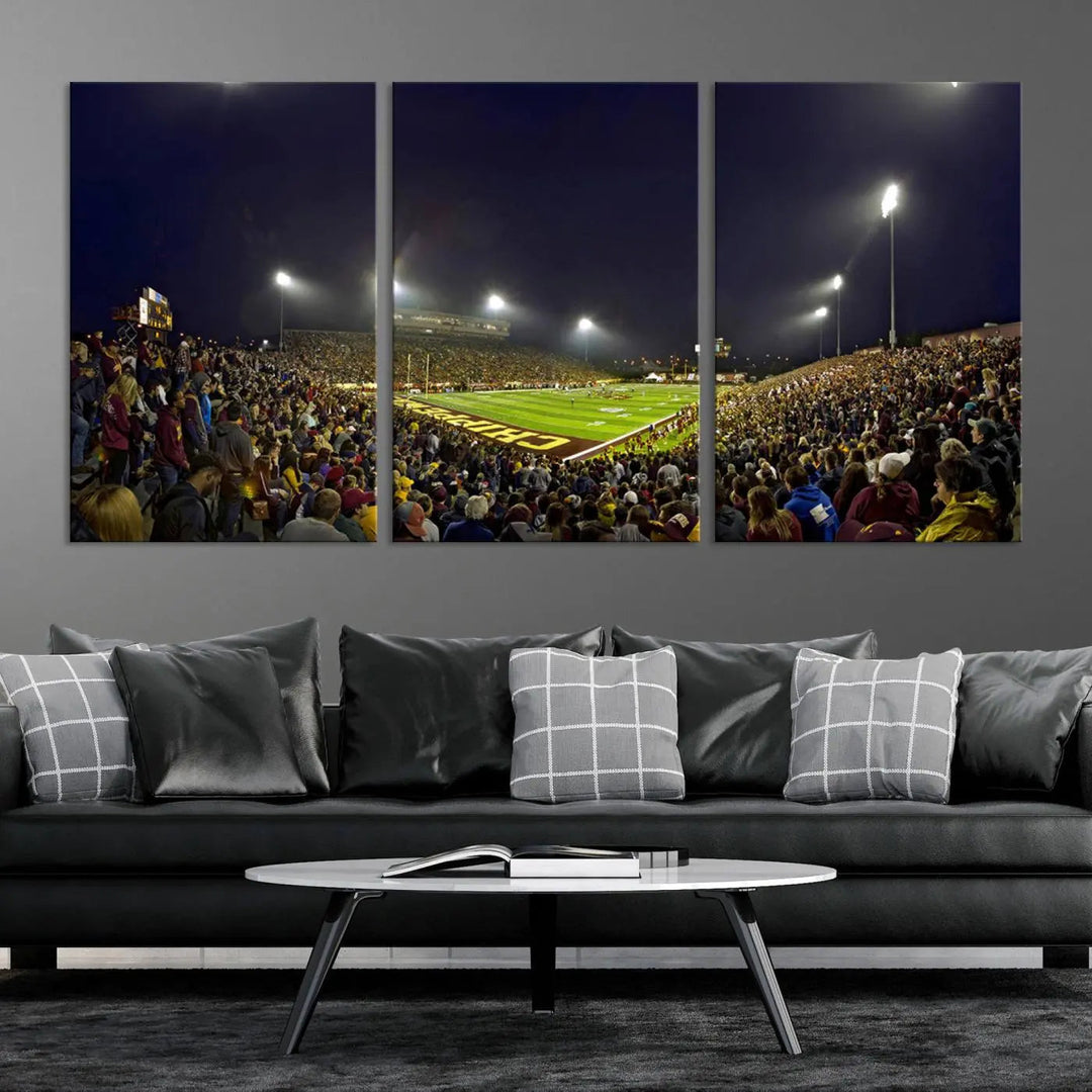 Experience the vibrant energy of a crowded football night under the bright lights of Kelly/Shorts Stadium, captured in our "Central Michigan University Chippewas Football Team Print - Mount Pleasant Kelly/Shorts Stadium Wall Art Canvas Print." This triple canvas wall art encapsulates excitement in every corner.