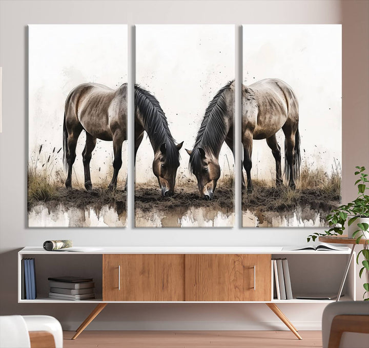 A Chinese Ink Style Horses Wall Art Canvas Print featuring two horses grazing is displayed in a modern setting.