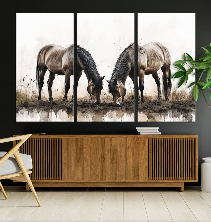 A Chinese Ink Style Horses Wall Art Canvas Print featuring two horses grazing is displayed in a modern setting.