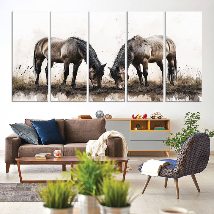 A Chinese Ink Style Horses Wall Art Canvas Print featuring two horses grazing is displayed in a modern setting.