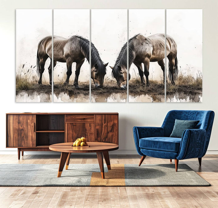 A Chinese Ink Style Horses Wall Art Canvas Print featuring two horses grazing is displayed in a modern setting.