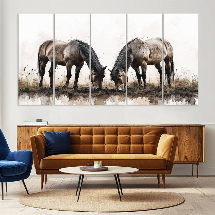 A Chinese Ink Style Horses Wall Art Canvas Print featuring two horses grazing is displayed in a modern setting.