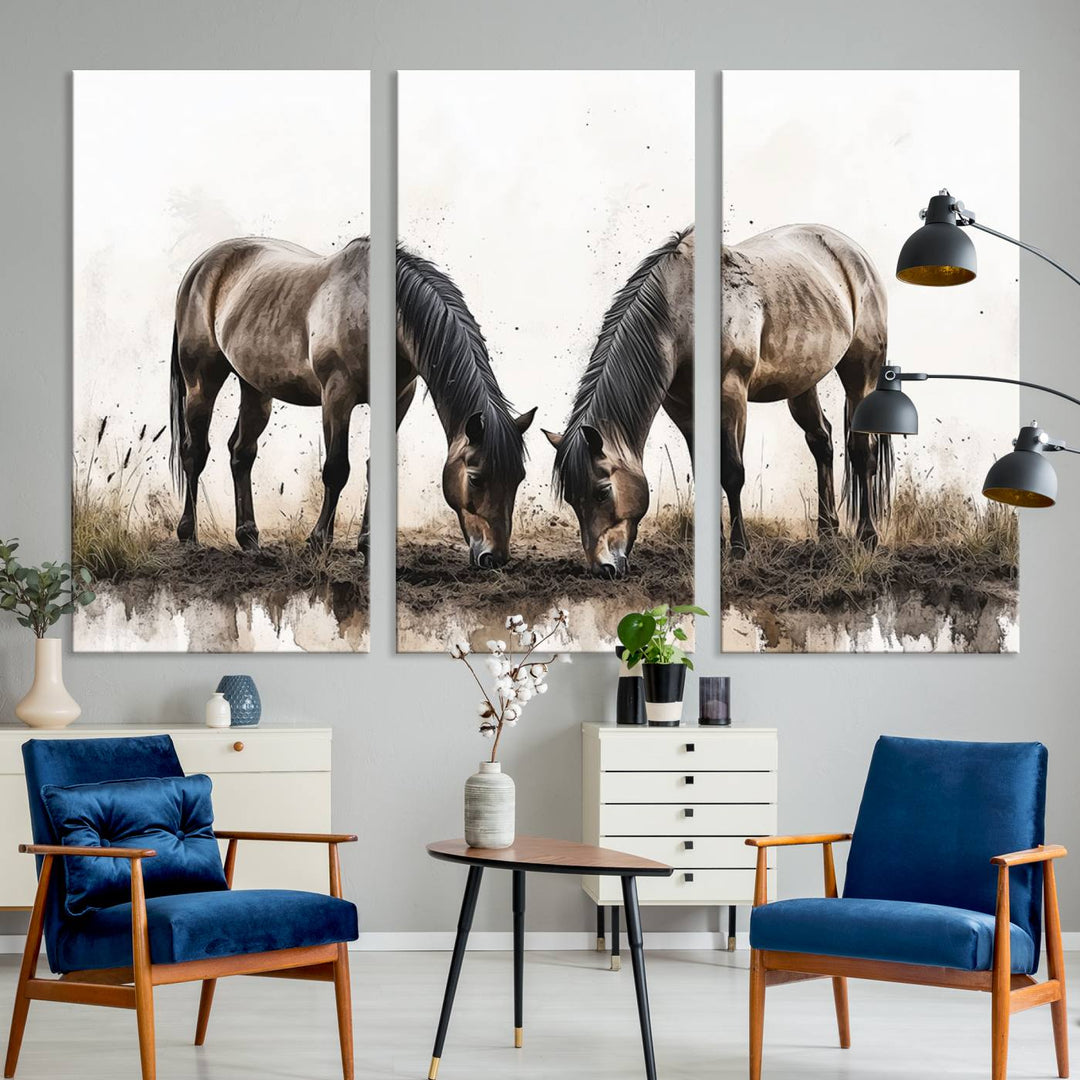 A Chinese Ink Style Horses Wall Art Canvas Print featuring two horses grazing is displayed in a modern setting.