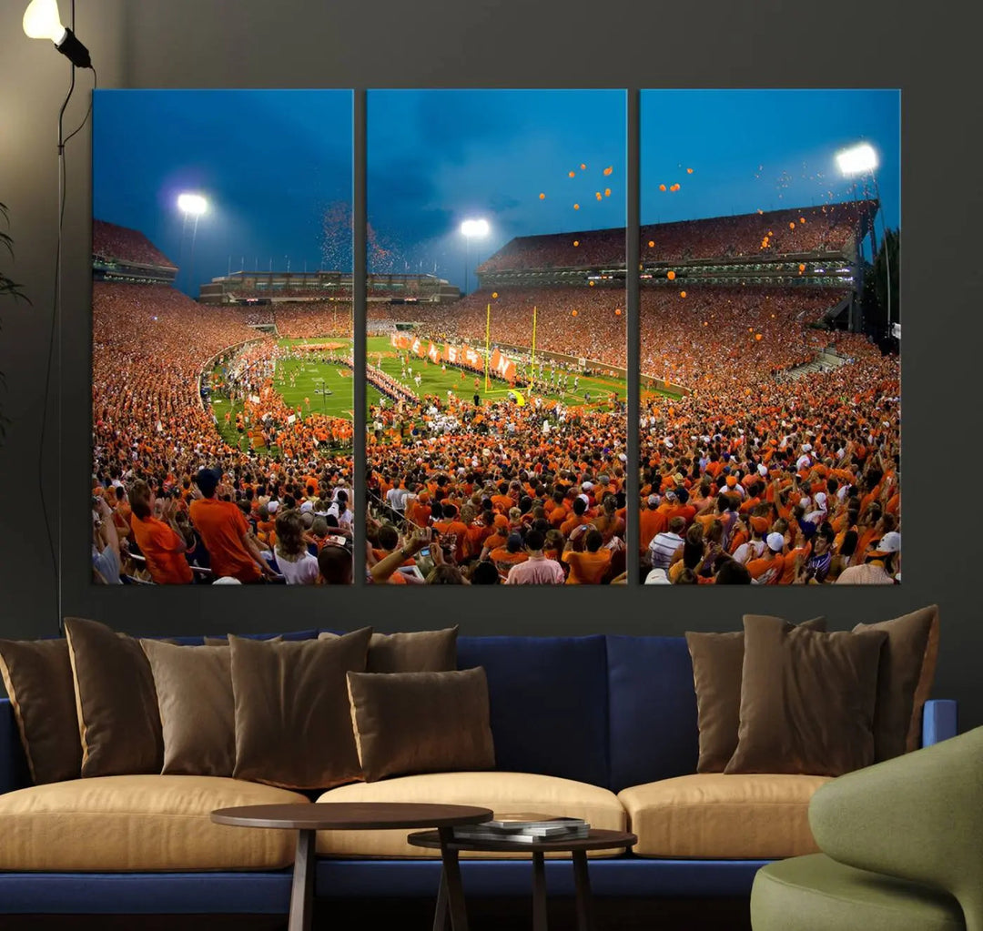 Imagine a stunning wall art canvas that captures the excitement and energy of a large football stadium packed with fans donned in orange. This Clemson University Tigers Football Team Print showcases Clemson Memorial Stadium under vibrant lights, transforming history into an enduring masterpiece.