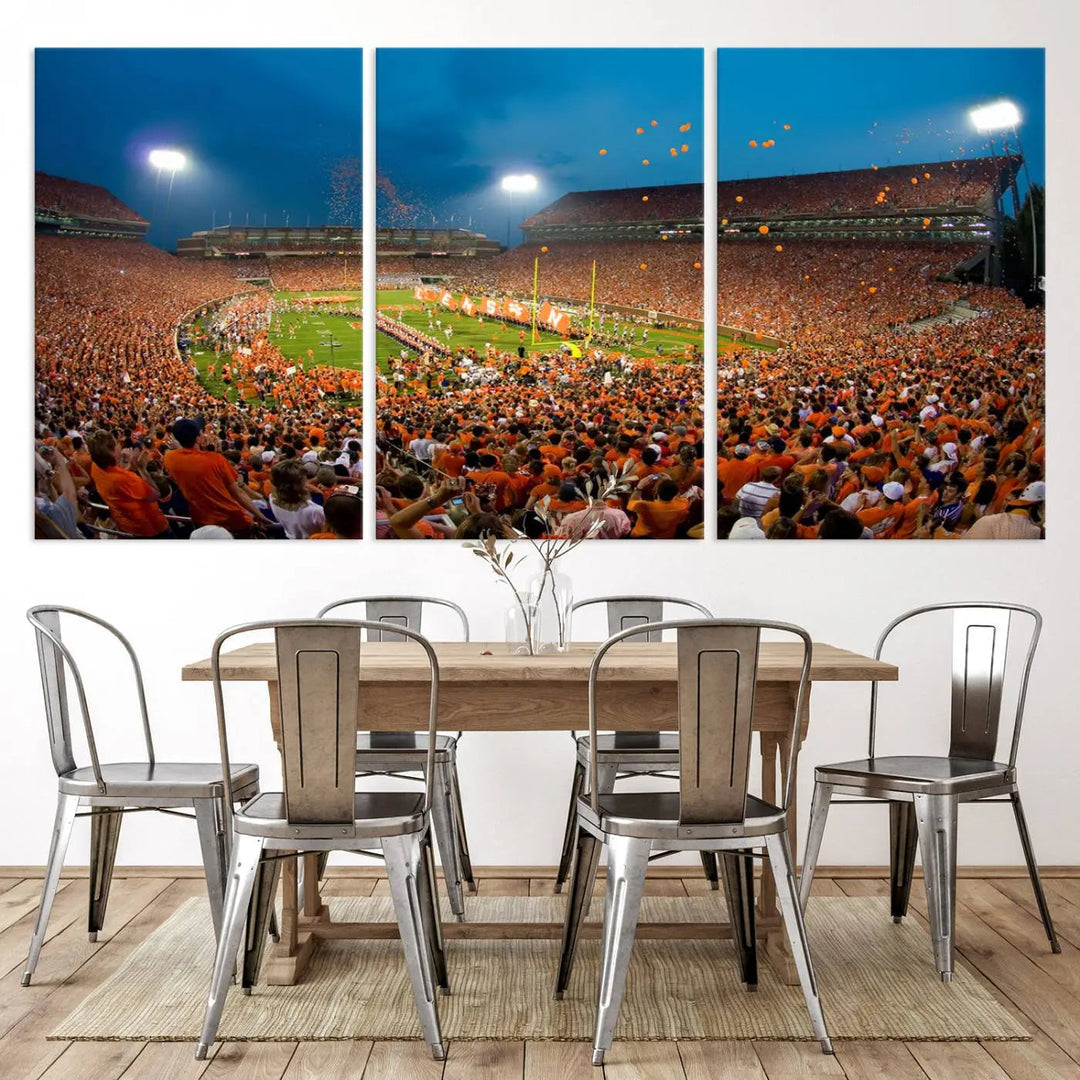 Imagine a stunning wall art canvas that captures the excitement and energy of a large football stadium packed with fans donned in orange. This Clemson University Tigers Football Team Print showcases Clemson Memorial Stadium under vibrant lights, transforming history into an enduring masterpiece.