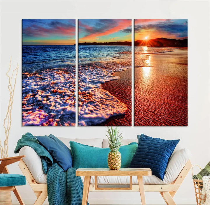 A captivating multi-panel seascape wall art showcases the Colorful Coastal Sunset on the Beach Canvas Print, depicting ocean waves crashing at dusk.