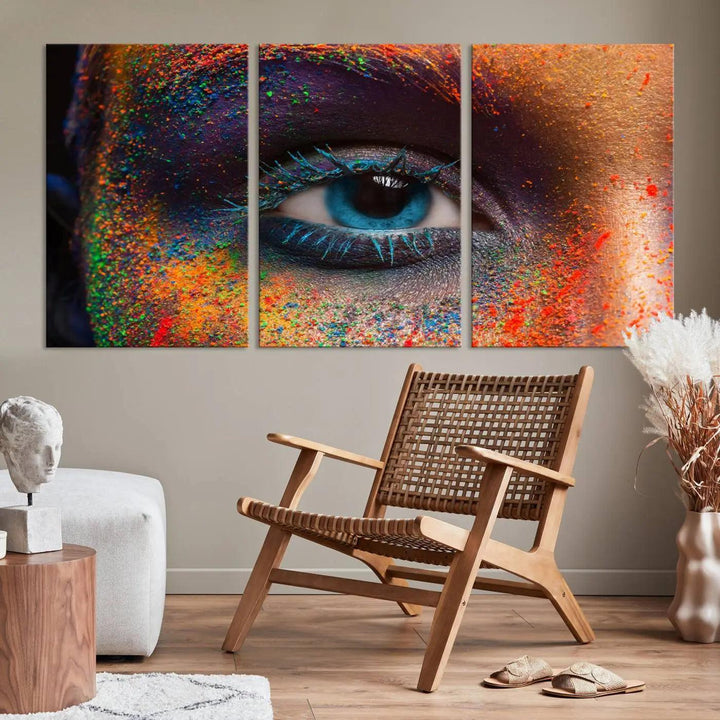 The contemporary living room is enhanced by a multi-panel canvas wall art piece titled "Colorful Eye Close Up Canvas Wall Art Print," which adds a vibrant touch to the gallery-wrapped design on the wall.