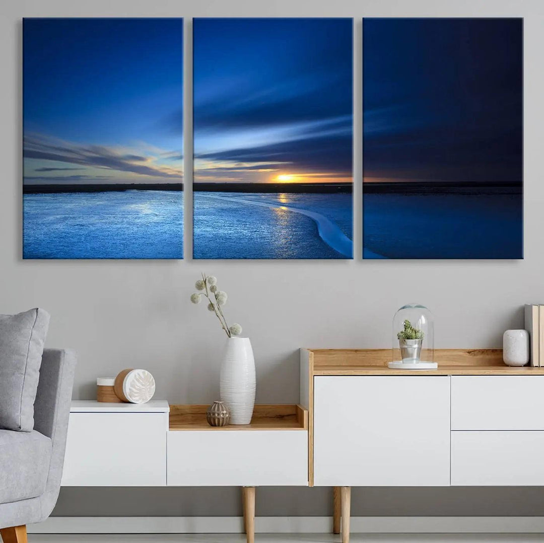 Deep blue ocean sunset triptych canvas art featuring a serene coastal sunset. Ideal for modern interiors. High-quality giclee canvas print.