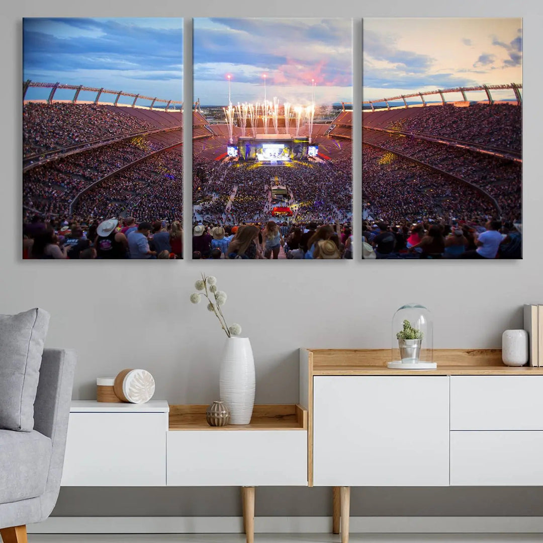 The Denver Broncos Football Team Print of Empower Field at Mile High Stadium adorns the wall, capturing a vibrant concert scene in a packed stadium at sunset with fireworks bursting above. This premium canvas offers an exquisite gallery-quality finish that perfectly complements the lively atmosphere.