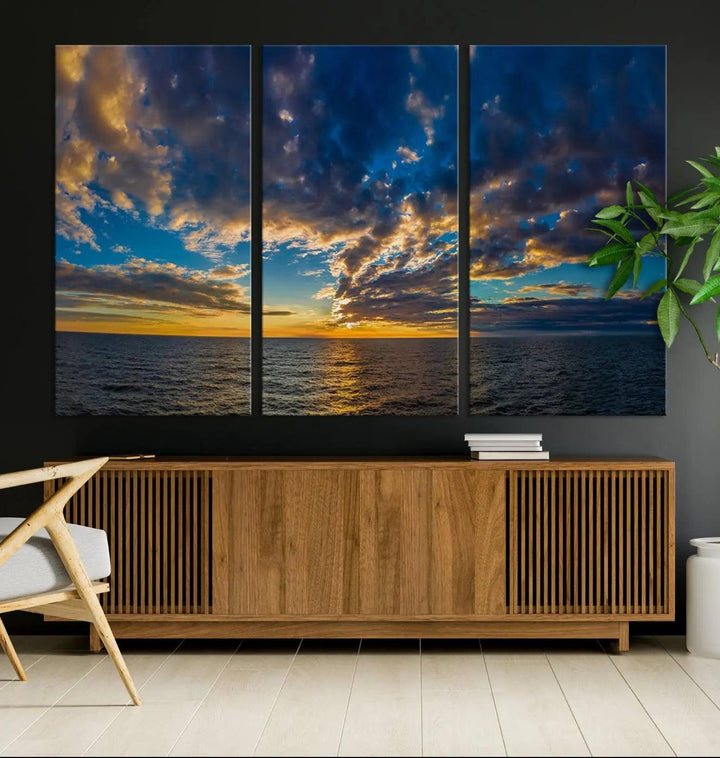 The Dramatic Ocean Sunset Canvas Art, a panoramic seascape wall art crafted using Canon-quality giclee canvas printing, beautifully captures a tranquil ocean view beneath dramatic clouds.