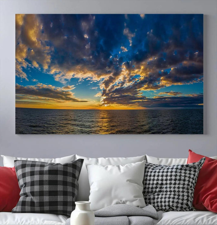 The Dramatic Ocean Sunset Canvas Art, a panoramic seascape wall art crafted using Canon-quality giclee canvas printing, beautifully captures a tranquil ocean view beneath dramatic clouds.