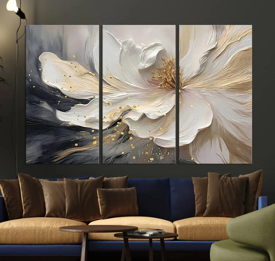 The Elegant White and Gold Floral Triptych Canvas Wall Art transforms the space into a glamorous setting with its modern textured flower design in neutral tones.