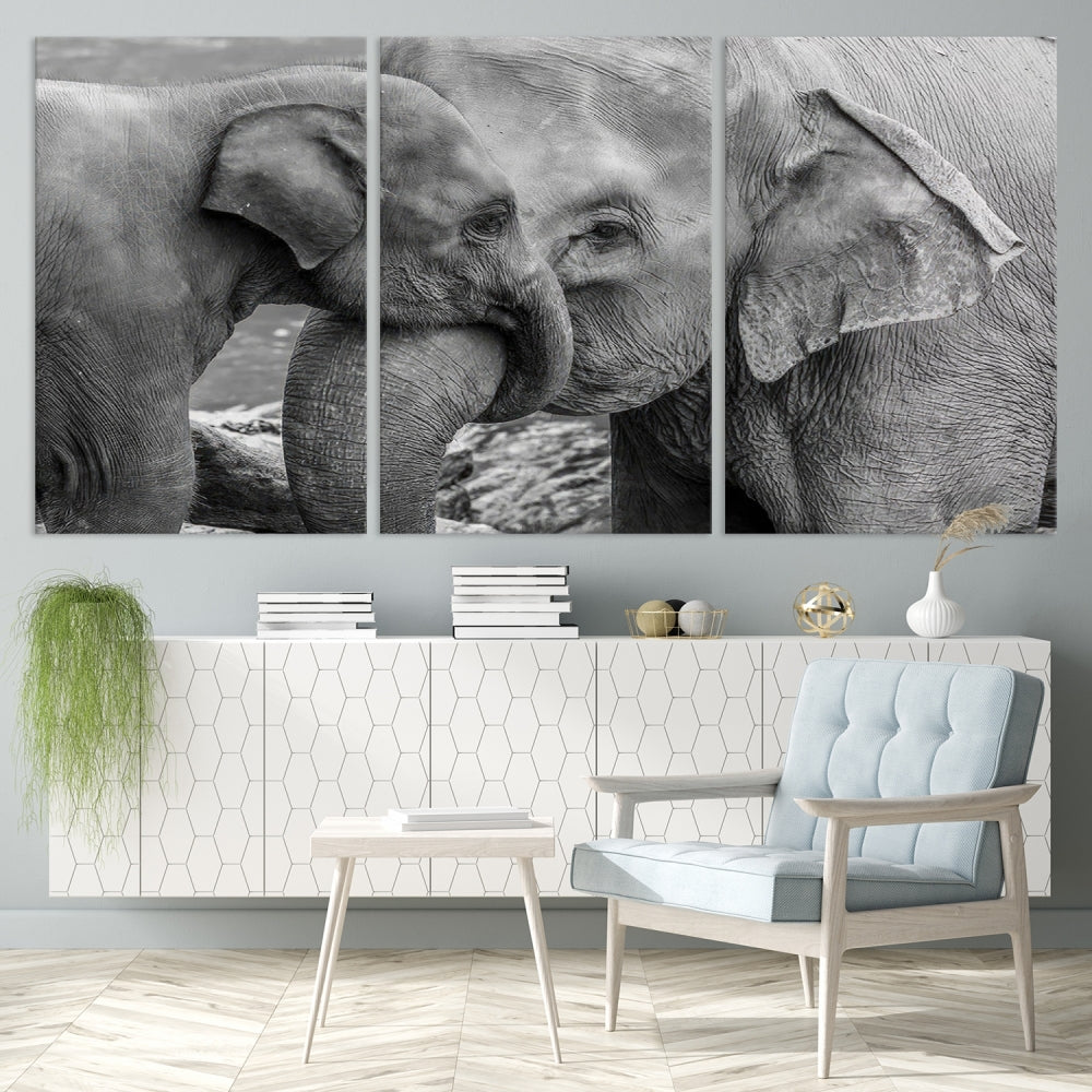 The Elephant Family Wall Art Canvas Print, depicting a black and white triptych of elephants embracing, is a museum-quality piece meticulously hand-assembled into framed art. This elegant canvas combines sophistication with the convenience of free shipping.