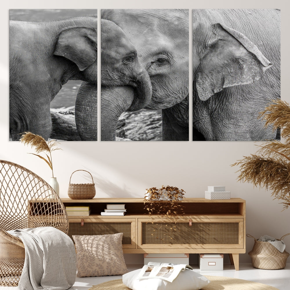 The Elephant Family Wall Art Canvas Print, depicting a black and white triptych of elephants embracing, is a museum-quality piece meticulously hand-assembled into framed art. This elegant canvas combines sophistication with the convenience of free shipping.