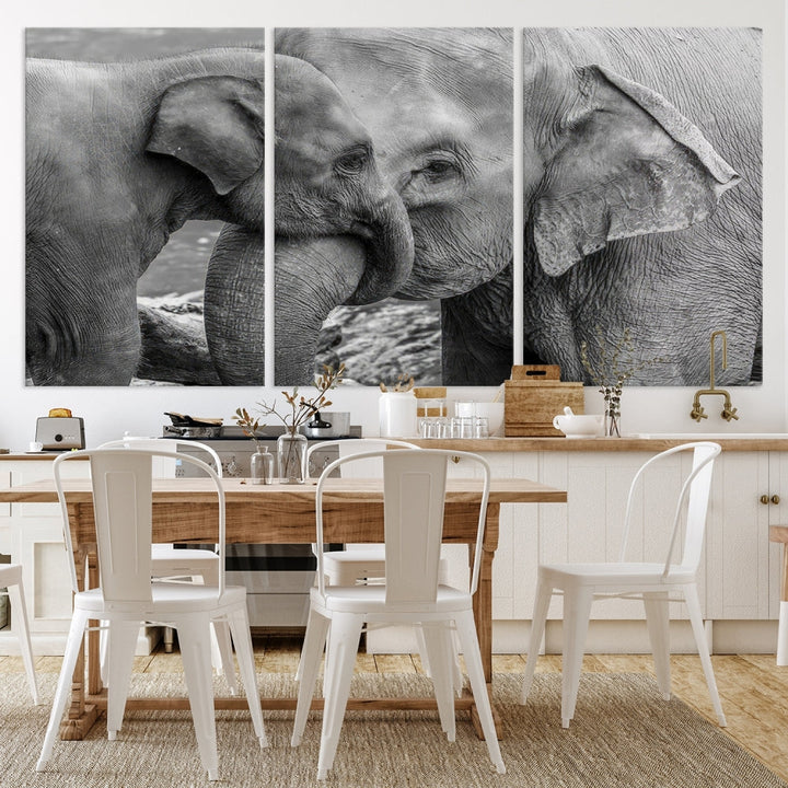 The Elephant Family Wall Art Canvas Print, depicting a black and white triptych of elephants embracing, is a museum-quality piece meticulously hand-assembled into framed art. This elegant canvas combines sophistication with the convenience of free shipping.