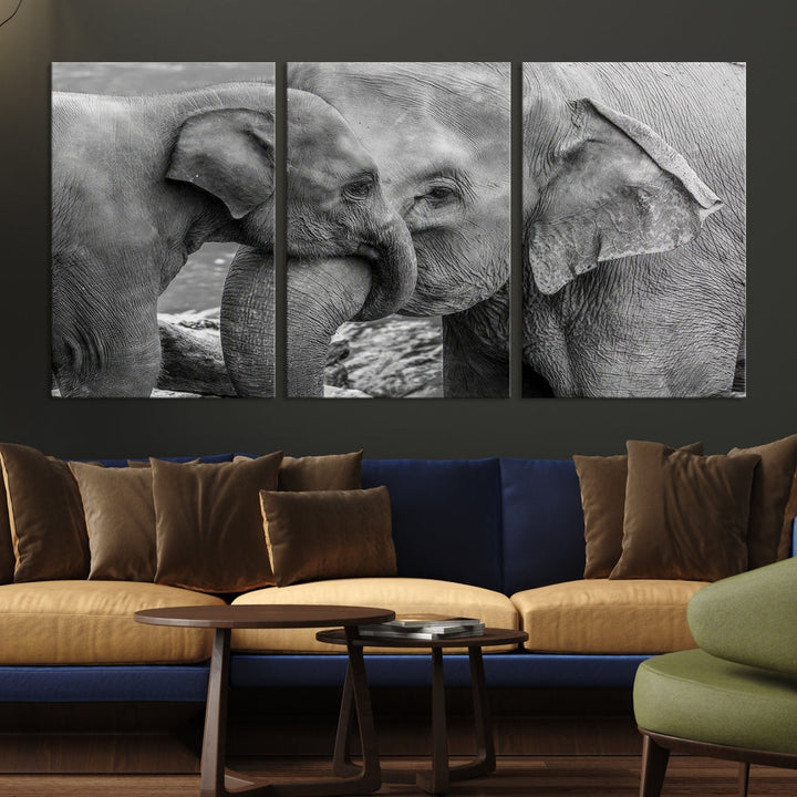 The Elephant Family Wall Art Canvas Print, depicting a black and white triptych of elephants embracing, is a museum-quality piece meticulously hand-assembled into framed art. This elegant canvas combines sophistication with the convenience of free shipping.