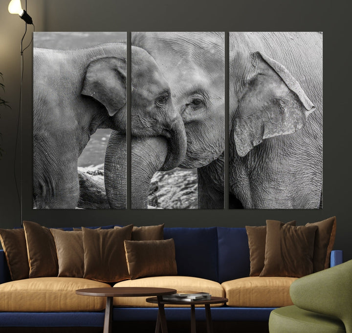 The Elephant Family Wall Art Canvas Print, depicting a black and white triptych of elephants embracing, is a museum-quality piece meticulously hand-assembled into framed art. This elegant canvas combines sophistication with the convenience of free shipping.