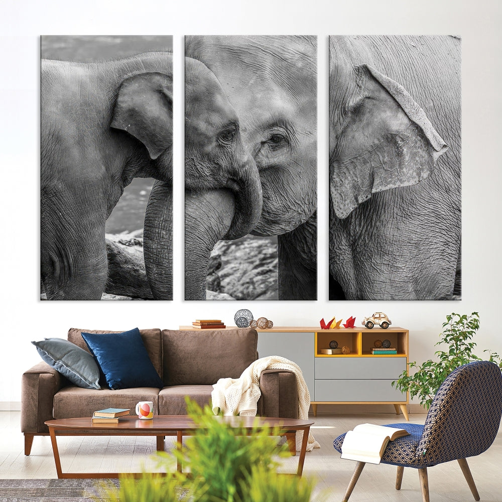 The Elephant Family Wall Art Canvas Print, depicting a black and white triptych of elephants embracing, is a museum-quality piece meticulously hand-assembled into framed art. This elegant canvas combines sophistication with the convenience of free shipping.