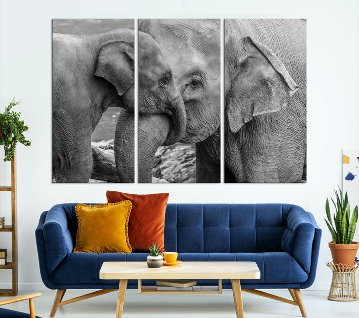 The Elephant Family Wall Art Canvas Print, depicting a black and white triptych of elephants embracing, is a museum-quality piece meticulously hand-assembled into framed art. This elegant canvas combines sophistication with the convenience of free shipping.