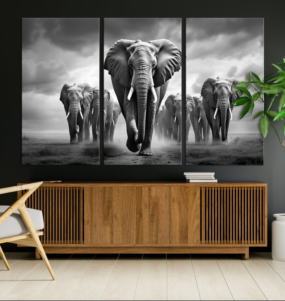 The Elephant Family Wall Art Canvas Print is displayed as a triptych. Each piece is gallery-wrapped on museum-quality canvases for an elegant finish.