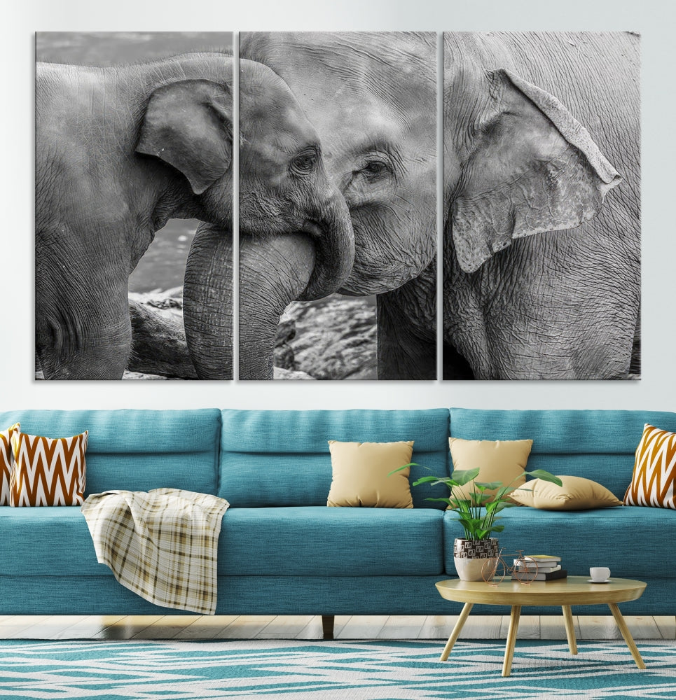 The Elephant Family Wall Art Canvas Print, depicting a black and white triptych of elephants embracing, is a museum-quality piece meticulously hand-assembled into framed art. This elegant canvas combines sophistication with the convenience of free shipping.