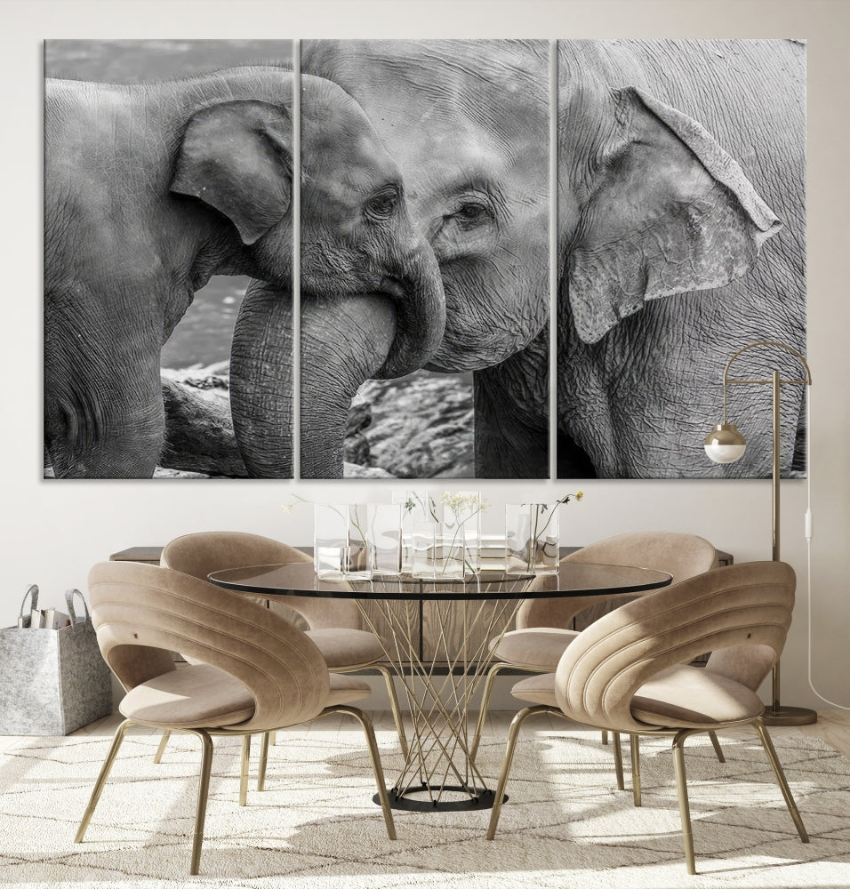 The Elephant Family Wall Art Canvas Print, depicting a black and white triptych of elephants embracing, is a museum-quality piece meticulously hand-assembled into framed art. This elegant canvas combines sophistication with the convenience of free shipping.