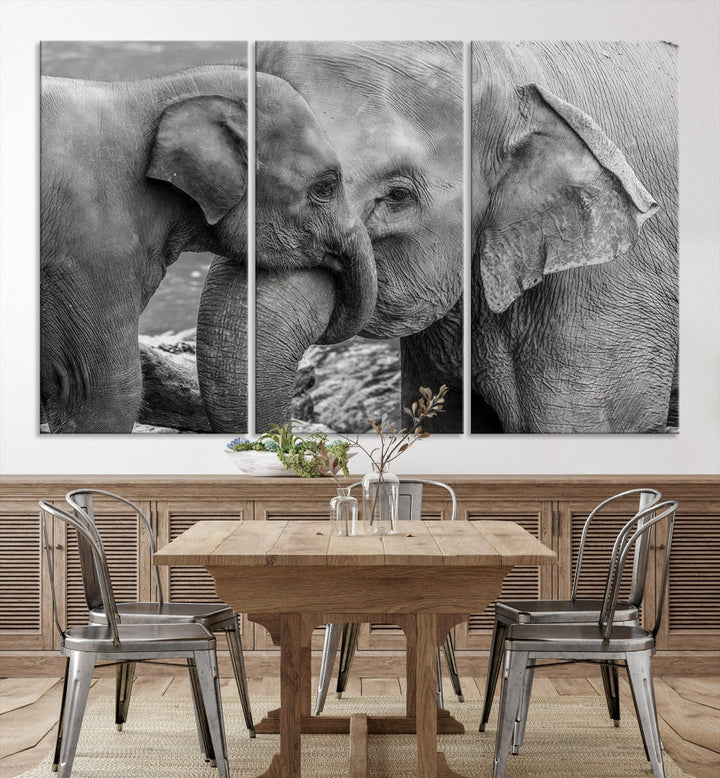 The Elephant Family Wall Art Canvas Print, depicting a black and white triptych of elephants embracing, is a museum-quality piece meticulously hand-assembled into framed art. This elegant canvas combines sophistication with the convenience of free shipping.