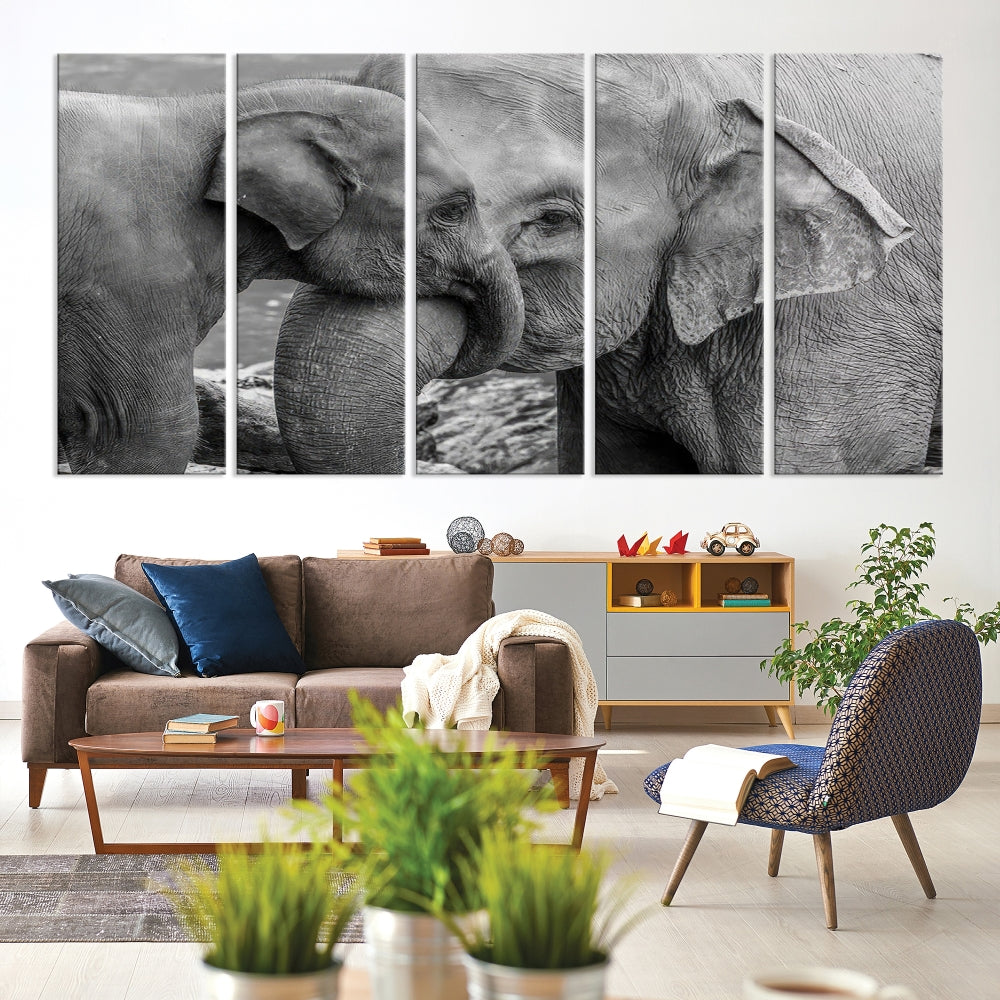 The Elephant Family Wall Art Canvas Print, depicting a black and white triptych of elephants embracing, is a museum-quality piece meticulously hand-assembled into framed art. This elegant canvas combines sophistication with the convenience of free shipping.