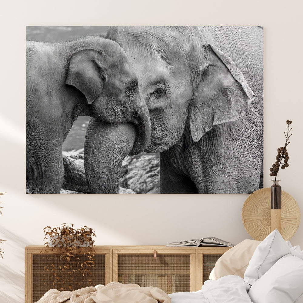 The Elephant Family Wall Art Canvas Print, depicting a black and white triptych of elephants embracing, is a museum-quality piece meticulously hand-assembled into framed art. This elegant canvas combines sophistication with the convenience of free shipping.