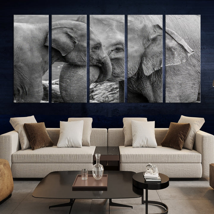 The Elephant Family Wall Art Canvas Print, depicting a black and white triptych of elephants embracing, is a museum-quality piece meticulously hand-assembled into framed art. This elegant canvas combines sophistication with the convenience of free shipping.