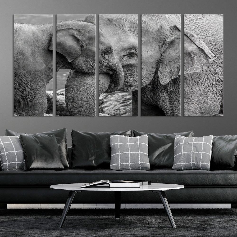 The Elephant Family Wall Art Canvas Print, depicting a black and white triptych of elephants embracing, is a museum-quality piece meticulously hand-assembled into framed art. This elegant canvas combines sophistication with the convenience of free shipping.