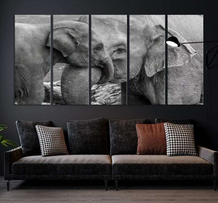 The Elephant Family Wall Art Canvas Print, depicting a black and white triptych of elephants embracing, is a museum-quality piece meticulously hand-assembled into framed art. This elegant canvas combines sophistication with the convenience of free shipping.